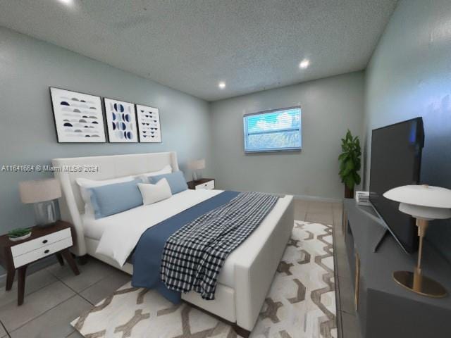 tiled bedroom featuring a textured ceiling