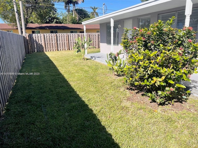 1005 NE 2nd St, Hallandale Beach, FL 33009 - view of yard with a fenced backyard