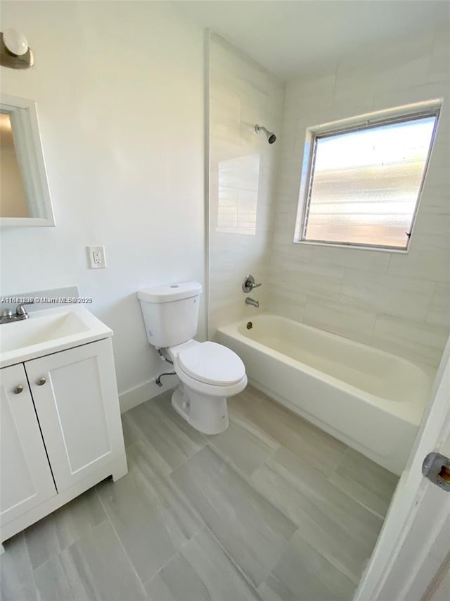 1005 NE 2nd St, Hallandale Beach, FL 33009 - full bathroom with baseboards, shower / bathtub combination, vanity, and toilet