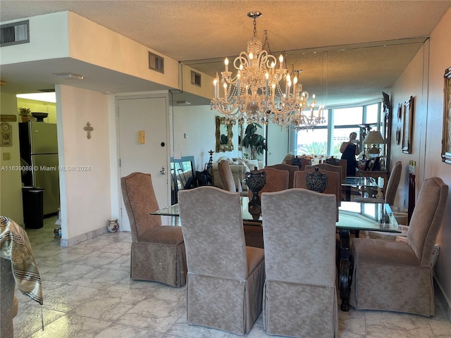 dining room with a textured ceiling