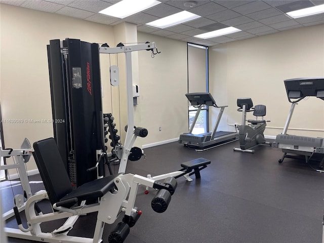 workout area with a paneled ceiling