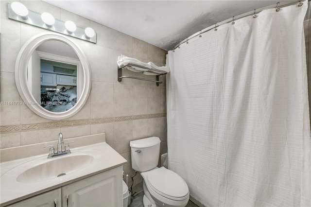 full bathroom with toilet, a shower with curtain, tile walls, and vanity