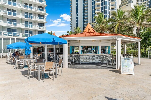 view of community with an outdoor bar