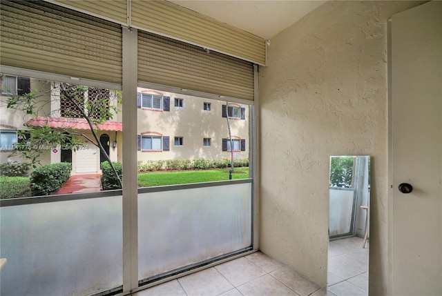 doorway featuring light tile patterned floors