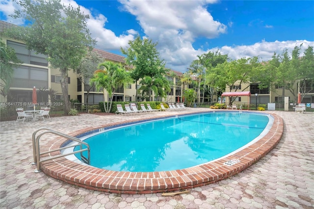 view of swimming pool featuring a patio area