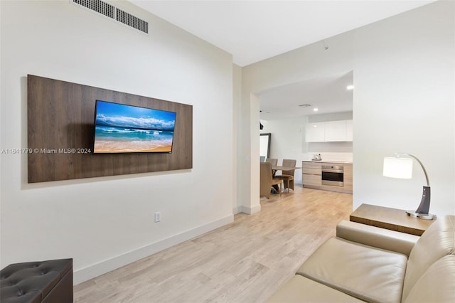 living room with light hardwood / wood-style floors