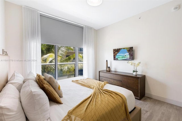 bedroom with light wood-type flooring