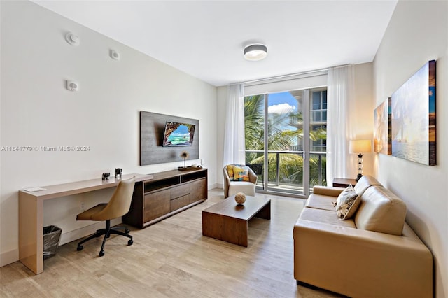 living room with light hardwood / wood-style flooring and built in desk