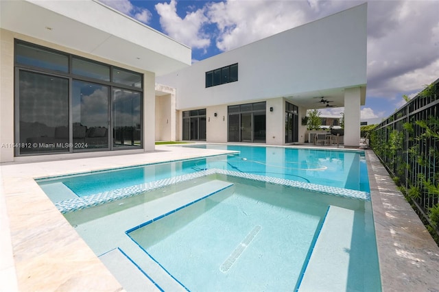 view of pool featuring ceiling fan