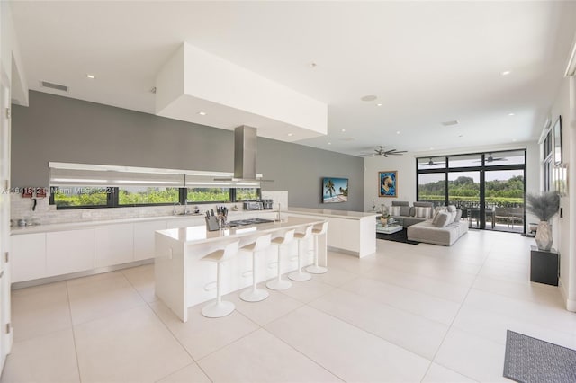 16768 Natures Way, Weston, FL 33326 - kitchen with modern cabinets, tasteful backsplash, white cabinets, open floor plan, and recessed lighting