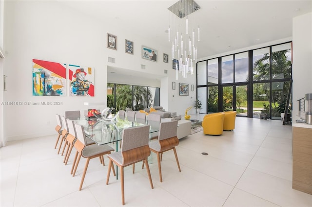 tiled dining area with expansive windows and a high ceiling