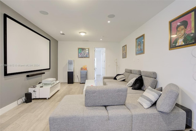 cinema featuring light hardwood / wood-style floors