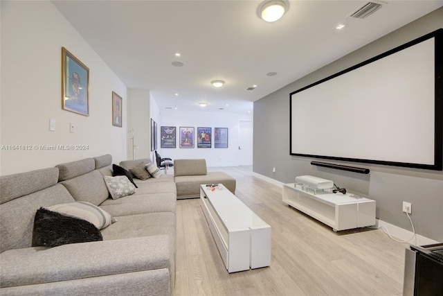 home theater room with light hardwood / wood-style flooring