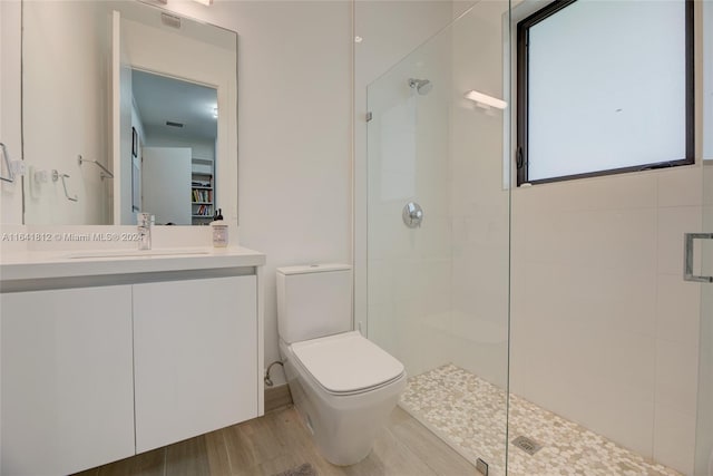 16768 Natures Way, Weston, FL 33326 - full bathroom featuring toilet, a stall shower, vanity, and wood finished floors