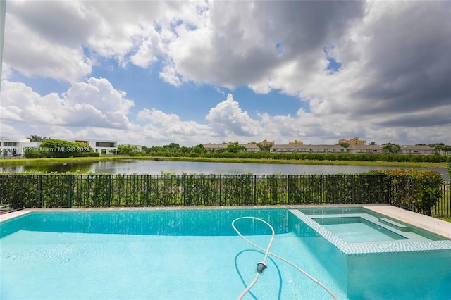 view of pool featuring an in ground hot tub