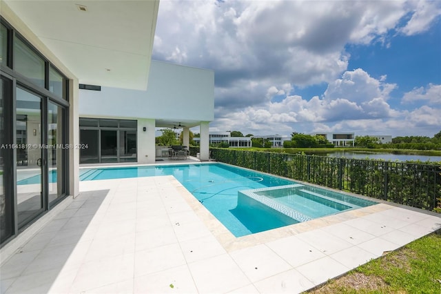 16768 Natures Way, Weston, FL 33326 - view of swimming pool with a patio area, a water view, a pool with connected hot tub, a ceiling fan, and outdoor dining space