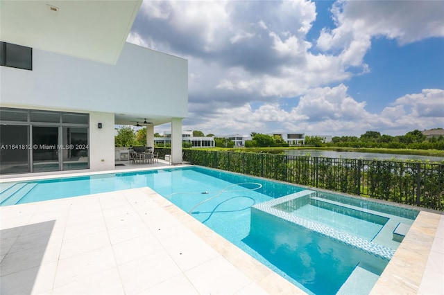 16768 Natures Way, Weston, FL 33326 - view of swimming pool featuring a patio, ceiling fan, outdoor dining area, a water view, and a pool with connected hot tub