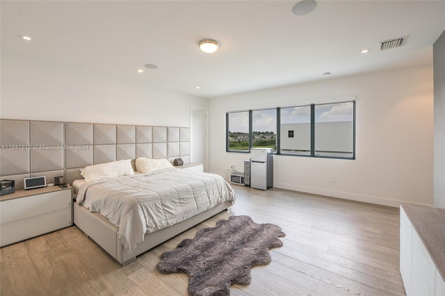 bedroom featuring light hardwood / wood-style floors