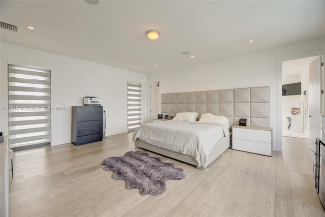 bedroom featuring light hardwood / wood-style floors