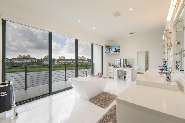 16768 Natures Way, Weston, FL 33326 - full bath featuring vanity, a freestanding bath, a water view, and recessed lighting