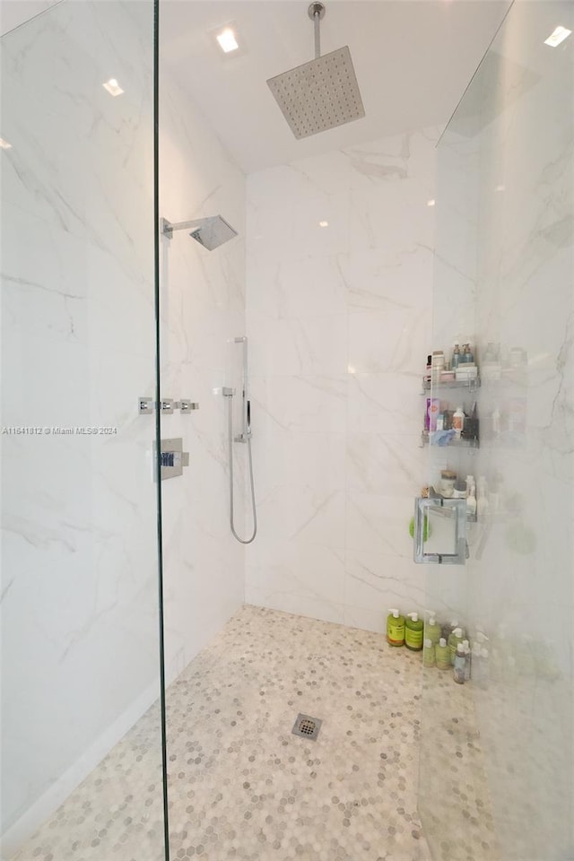 bathroom with a tile shower