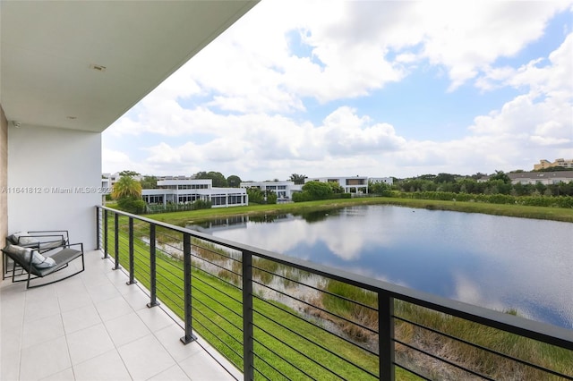 balcony featuring a water view