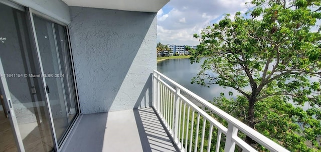 balcony featuring a water view