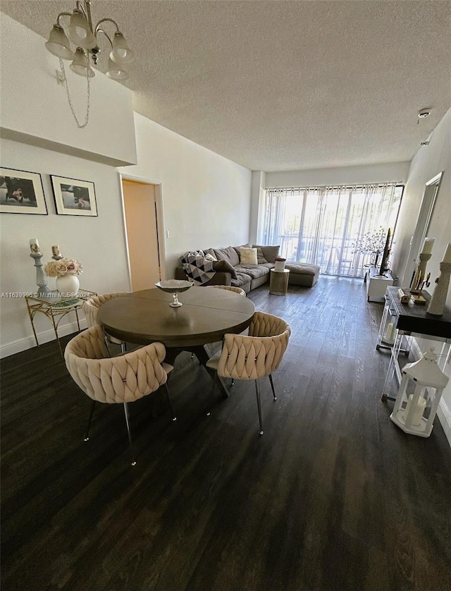 dining area with lofted ceiling, a textured ceiling, wood finished floors, and baseboards