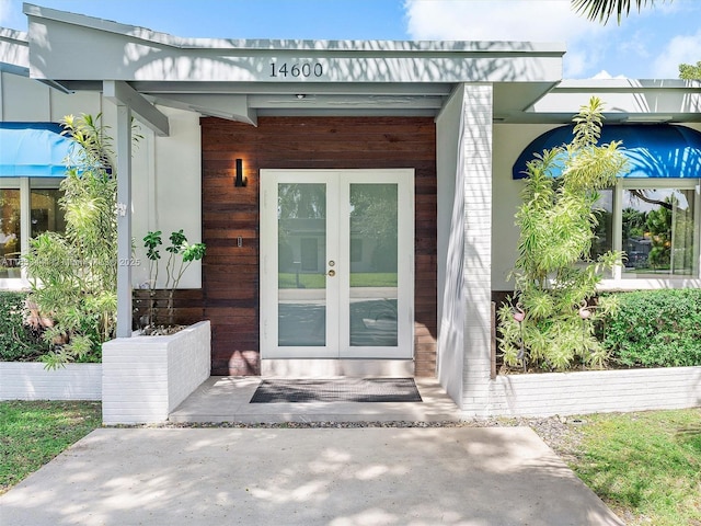 property entrance featuring french doors