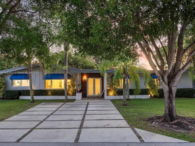 view of front of house with a lawn