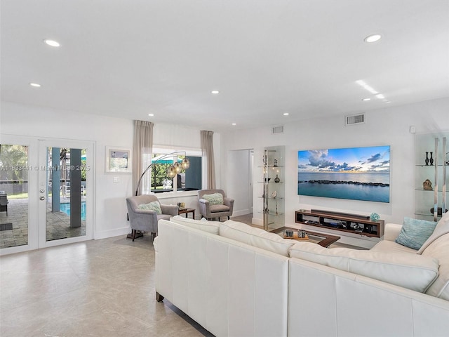 living room featuring baseboards, visible vents, french doors, and recessed lighting