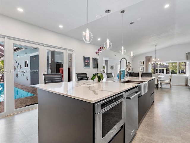 kitchen with pendant lighting, a spacious island, recessed lighting, vaulted ceiling, and modern cabinets