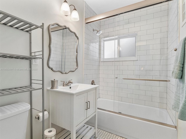 full bath featuring toilet, vanity, shower / tub combination, and tile patterned floors