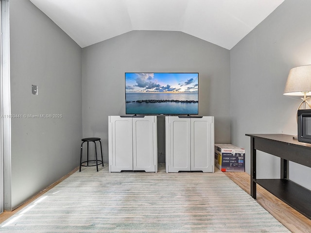 living area with lofted ceiling