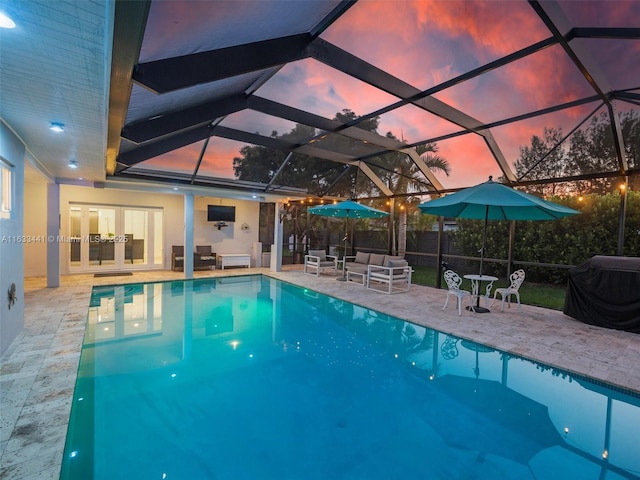 view of pool featuring a patio area, grilling area, outdoor lounge area, and a fenced in pool