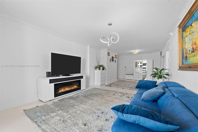 living room with a glass covered fireplace, an inviting chandelier, and ornamental molding