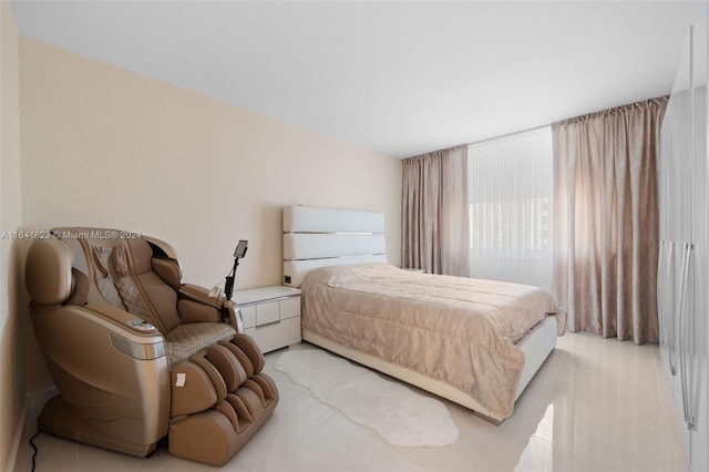 bedroom featuring light tile patterned flooring