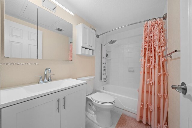 bathroom featuring shower / bath combo with shower curtain, visible vents, toilet, and vanity