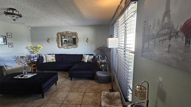 living room featuring a textured ceiling and tile patterned floors