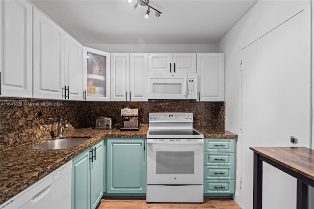 kitchen with light hardwood / wood-style floors, sink, white appliances, and white cabinets