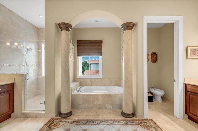 bathroom featuring ornate columns, vanity, a bidet, and tile patterned flooring