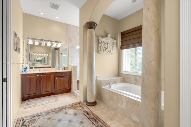 bathroom with tile patterned floors, vanity, and independent shower and bath