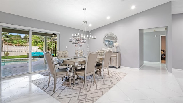 tiled dining space with lofted ceiling