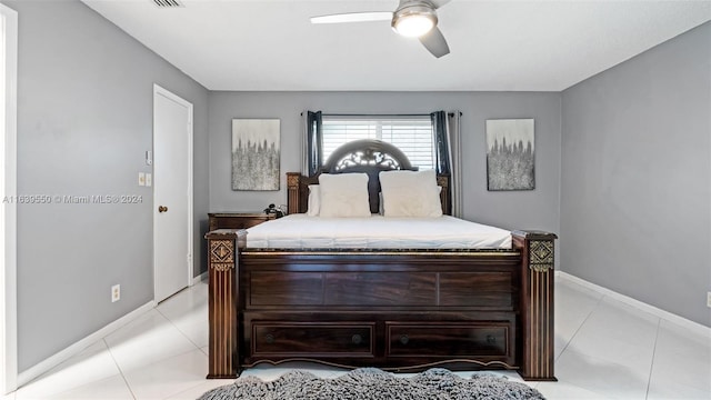 bedroom with ceiling fan and light tile patterned flooring