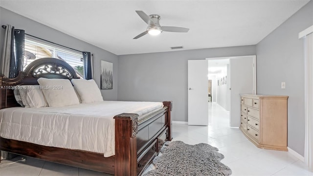 bedroom featuring light tile patterned flooring and ceiling fan