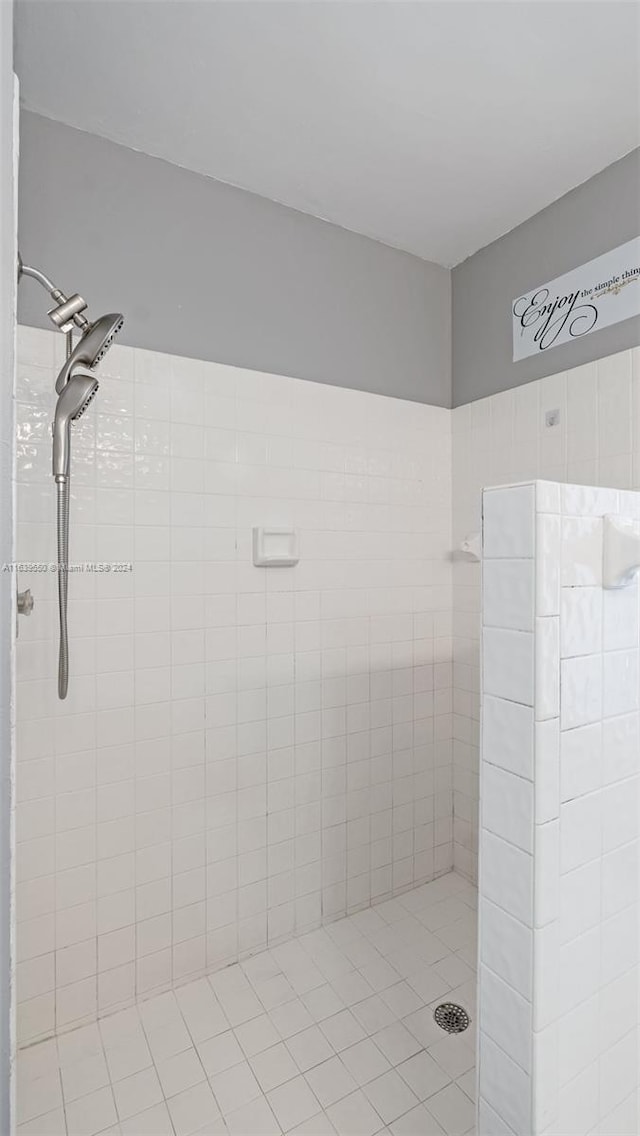 bathroom with tiled shower