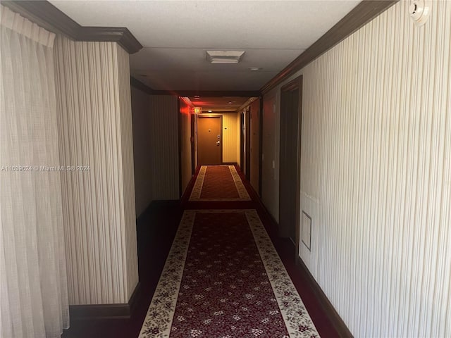 hallway featuring ornamental molding