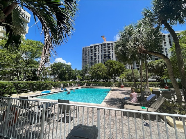 view of pool featuring a patio