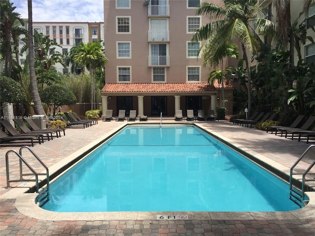 view of swimming pool featuring a patio area