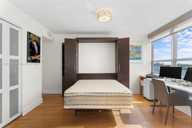 bedroom featuring light wood-type flooring